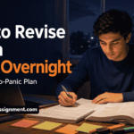 Student reviewing notes and flashcards at a desk late at night before an exam